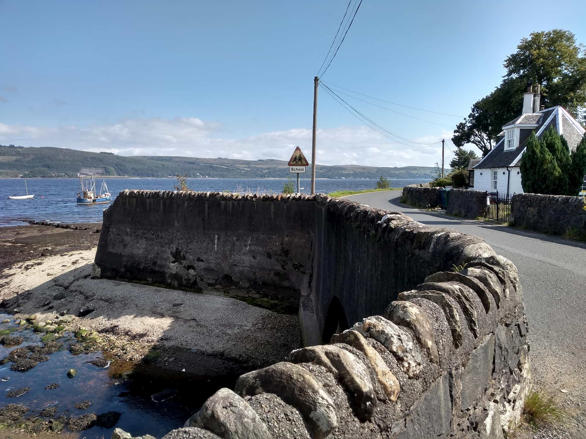 Coastal road winding alongside water